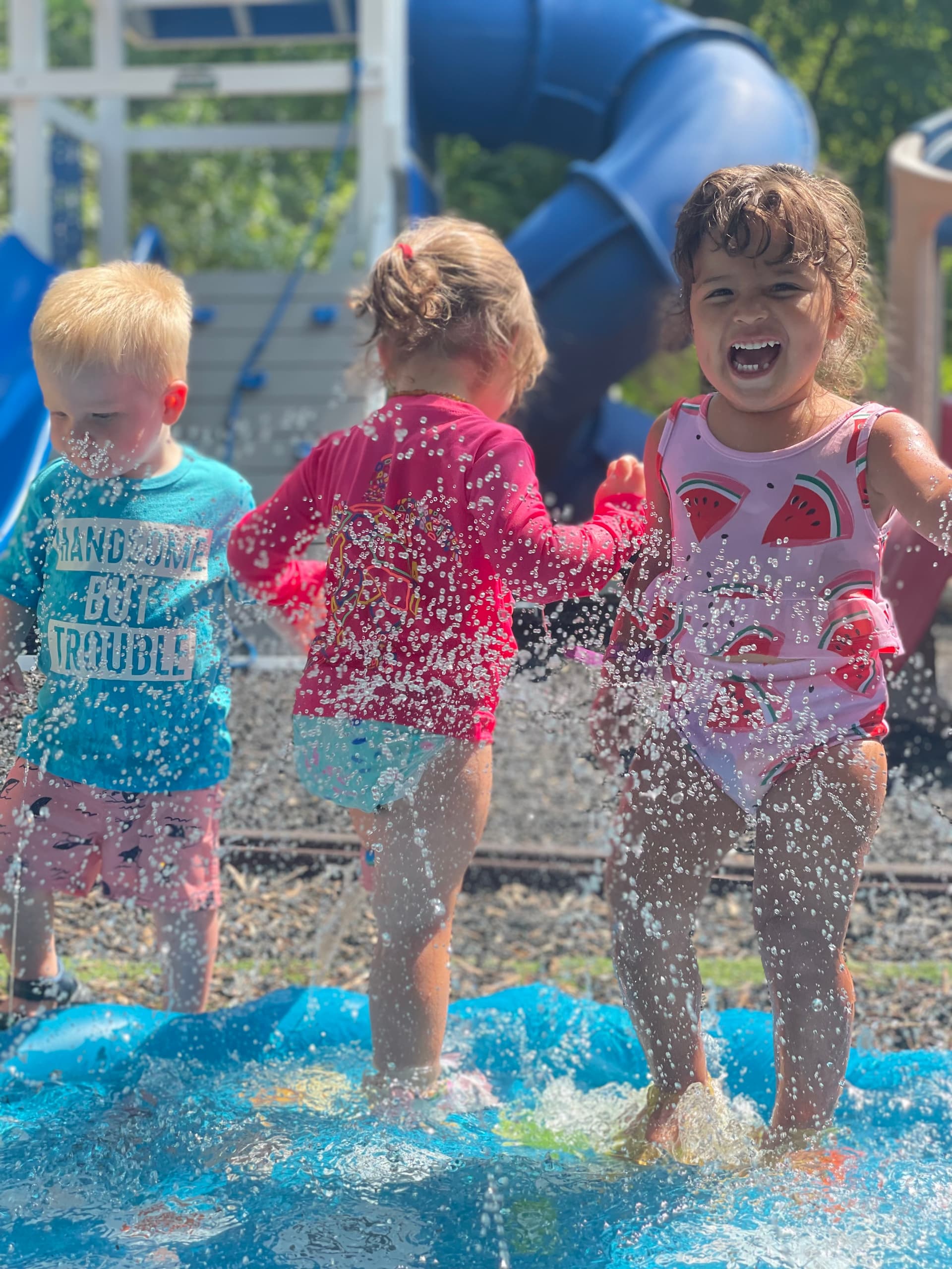 Summer Camp Kids splashing in the water